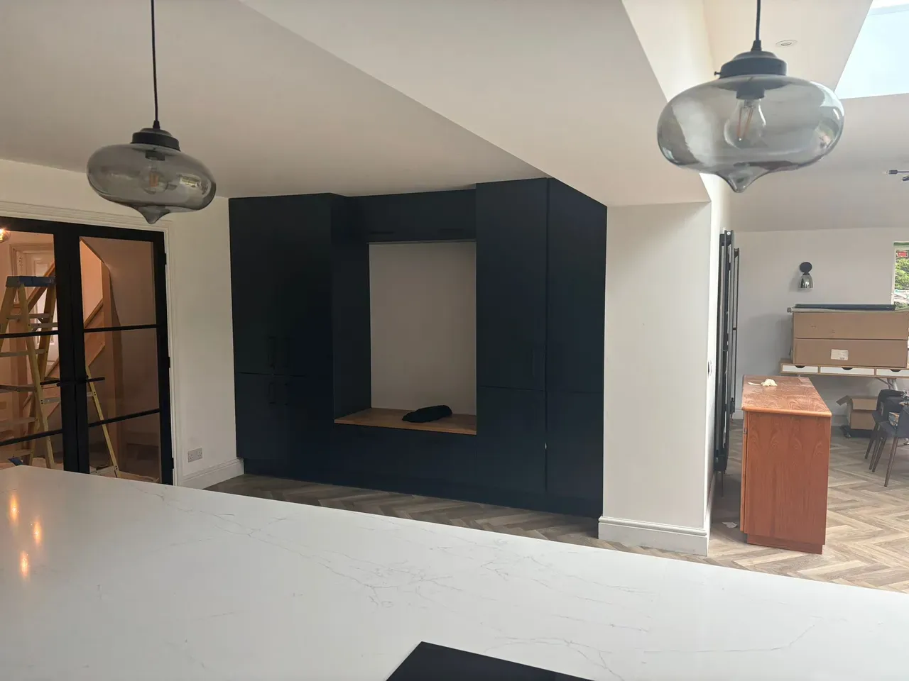 Navy shaker kitchen with crittall-style doors installed